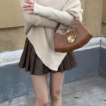 Vintage - inspired Rustic Caramel Leather Crescent Handbag with Ornate Golden Swirl Lock