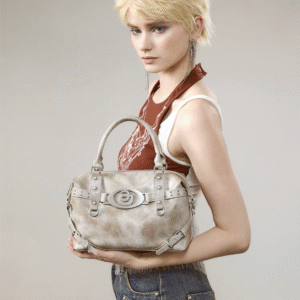Wasteland Radiance: Distressed Metallic Leather Handbag with Apocalyptic - inspired Studs and Badge