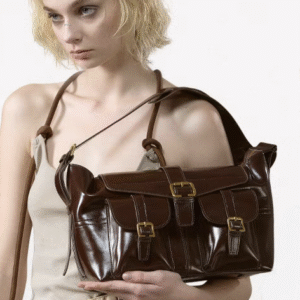 Opulent Reverie: Sumptuous Dark - toned Leather Shoulder Bag with Gleaming Gold Fasteners