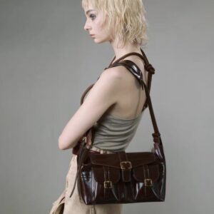 Opulent Reverie: Sumptuous Dark - toned Leather Shoulder Bag with Gleaming Gold Fasteners
